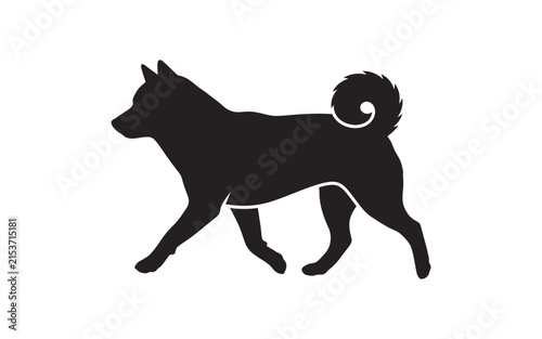 Black silhouette of a shiba inu dog walking on a white background
