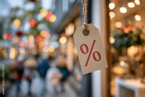 Discount price tag hanging at retail store showing consumer behavior inflation and search for lower prices on shopping street