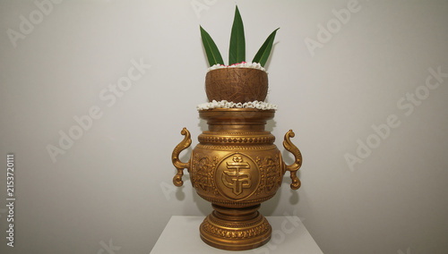 Traditional golden thai vase with lotus flower petals as a centerpiece traditional ornamental centerpiece cultural oriental ceremonial sculpture interior buddhism sculpted artifact