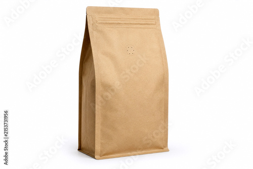 Blank kraft paper coffee bag mockup with degassing valve isolated on white background. Empty brown pouch template for roasted beans, tea, product branding and sustainable packaging.