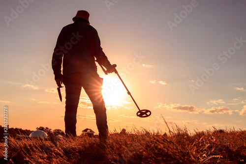 Evening Detectorist Silhouette with Digging Knife and Metal Detector