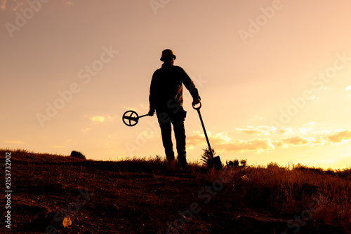 Sunset Treasure Hunter with Shovel and Metal Detector, Panama Hat