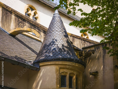 Architectural detail of the medieval Porte des Allemands fortifications in Metz, France, photographed on April 26, 2025. Stone turret with slate roof, historic masonry and defensive architectural elem