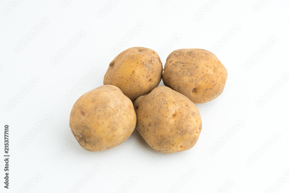 Fototapeta premium Small pile of fresh raw brown baby potatoes isolated on white background