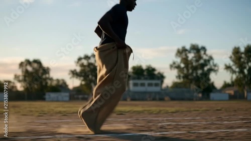 Sack race runner jumping outdoors 4K Video