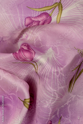 lilac silk fabric with purple tulips and wavy folds