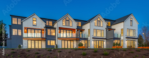 Konstfotografi colorful photograph exteriors of four connected townhouses painted white with th