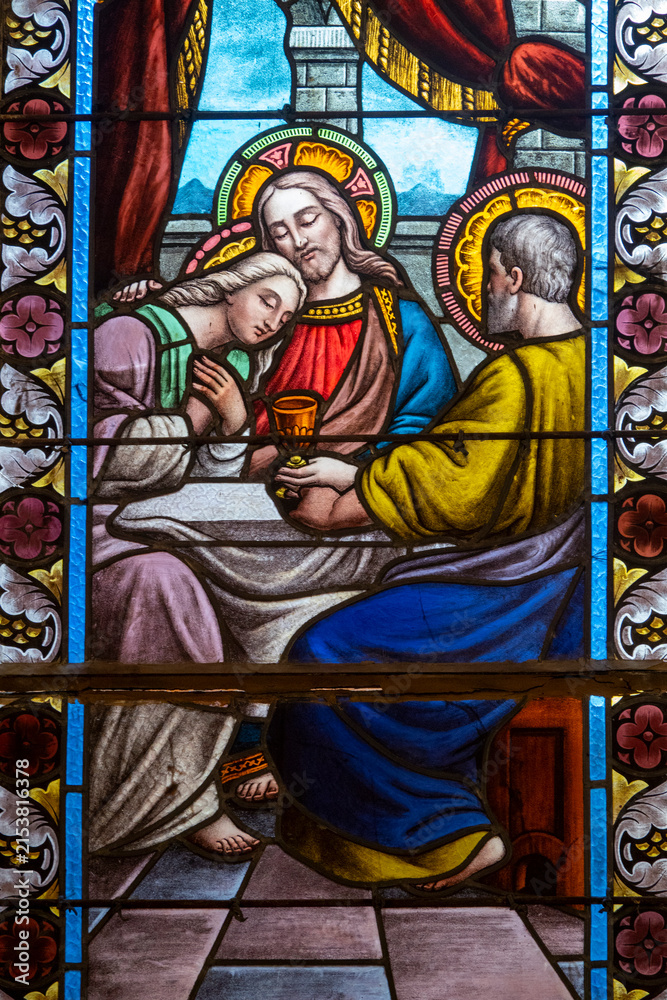 Fototapeta premium Stained glass showing Jesus with beloved disciple John.