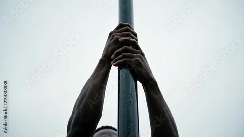 Man climbing pole outdoor workout 4K Video