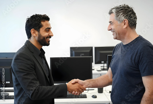 Two smiling diverse busines...