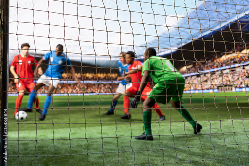 Obraz na plátně Selective-focus goalkeeper tracks a striker's footwork near the penalty area, guarding the goal post and preparing to stop a scoring chance in live match action during a competitive football attack