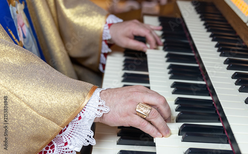 Картината върху платно Organist Playing Pipe Organ Keyboard During Musical Performance.