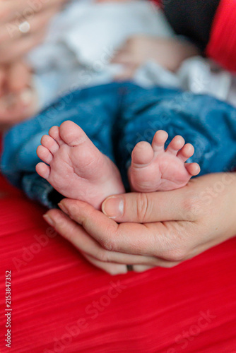Canvastavla Parent Holding Newborn Baby Feet Gently in Hands, Tender Family Bond and Care Mo