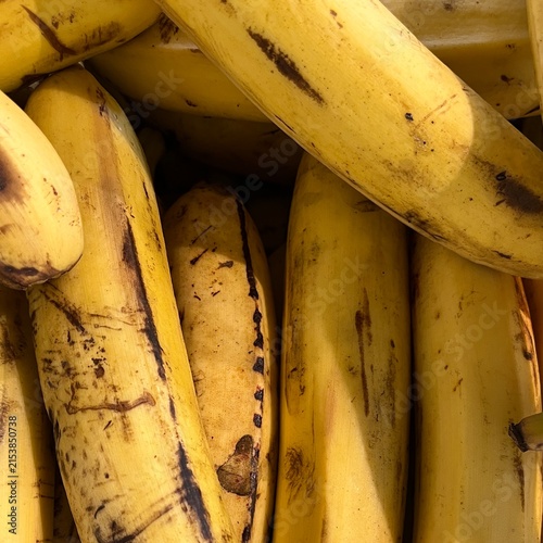 Close up of ripe yellow bananas with brown spots pattern