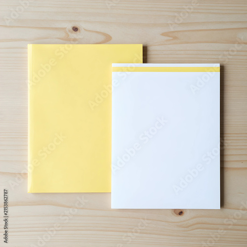 Yellow notebook and white n...