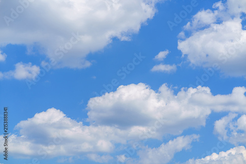 Clouds in the sky during daytime with blue background and white fluffiness