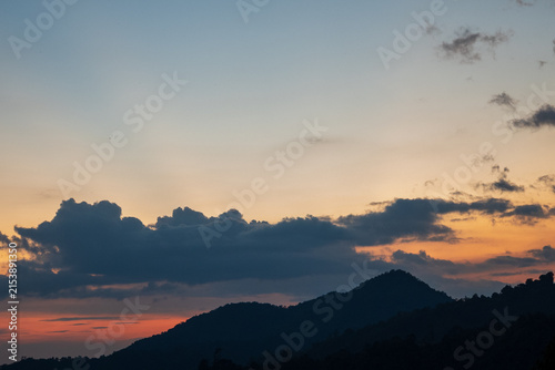 Blue golden sky sunrise dramatic beautiful landscape mountain. Dramatic sunset over mountain landscape. Beautiful landscape foggy hills twilight time. Dawn sky gold dusk time cloudscape with sunlight