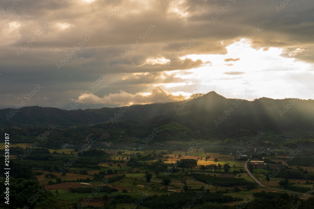 Fototapeta premium Sunrise mountain fog landscape Scenic view dramatic beautiful sky. Romantic landscape sunset foggy green mountain valley. Beautiful foggy hills sun light time. Morning nature golden dawn sky scenery