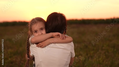 Mother child comforting sad daughter at sunset, emotional family moment outdoors, girl child kid hugging mom after a long day, loving embrace nature, parent child support during hard times, expressing