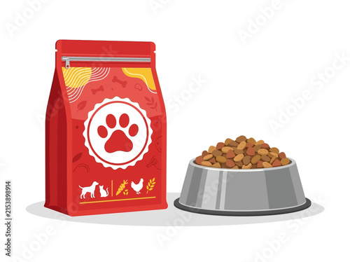 Red bag of dry pet food with a paw print logo next to a silver bowl filled with kibble on a white background, illustrating animal nutrition.