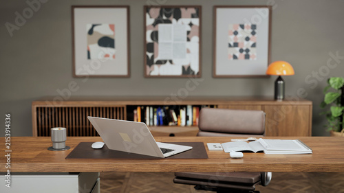 Mid Century Modern Home Office With Wooden Desk and Laptop