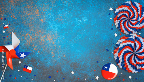 Pinwheel, fans, and flags celebrating chile fiestas patrias on blue background