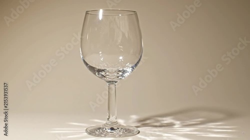 Empty transparency wineglass on white background. Elegant crystal stemware for luxury dining.