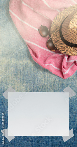 Summer Holiday Vacation Trip Mockup Concept Wallpaper with White Blank Free Space Paper Sheet with Adhesive Tape on Denim Surface. File with Clipping Path.