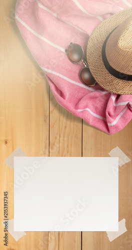 Summer Holiday Vacation Trip Mockup Concept Wallpaper with White Blank Free Space Paper Sheet with Adhesive Tape on Wooden Surface. File with Clipping Path.