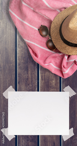 Summer Holiday Vacation Trip Mockup Concept Wallpaper with White Blank Free Space Paper Sheet with Adhesive Tape on Wooden Surface. File with Clipping Path.