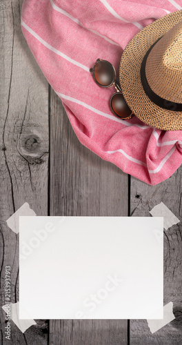 Summer Holiday Vacation Trip Mockup Concept Wallpaper with White Blank Free Space Paper Sheet with Adhesive Tape on Wooden Surface. File with Clipping Path.