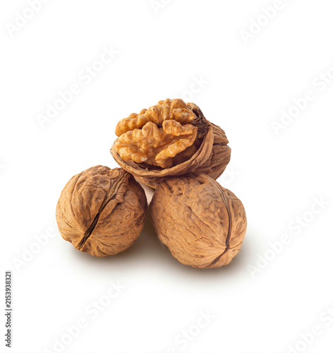 Whole and Cracked Walnuts on White Background