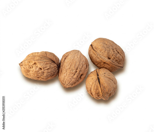 Group of Whole Walnuts on White Background