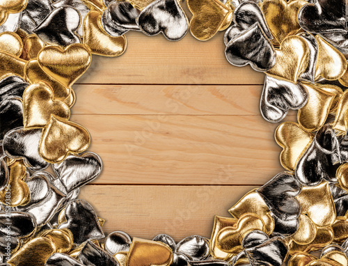 Gold and Silver Hearts on Wooden Background Perfect for Romantic Celebrations
