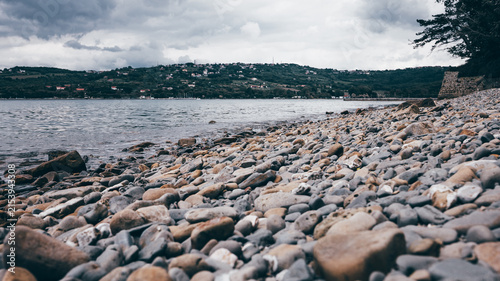 Pebble beach by calm water