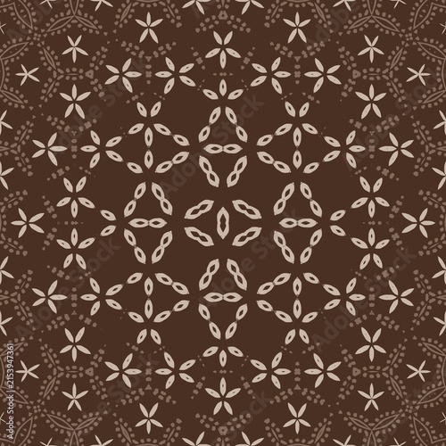 Fotografie Brown background with intricate, repeating floral patterns