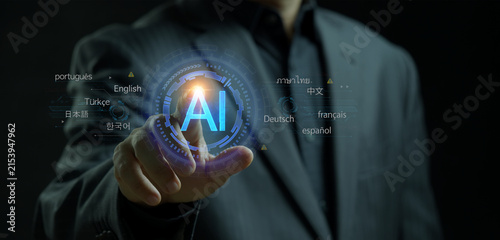 Quadro su tela Businessman finger touching glowing AI artificial intelligence circular icon surrounded by technical keyword labels display