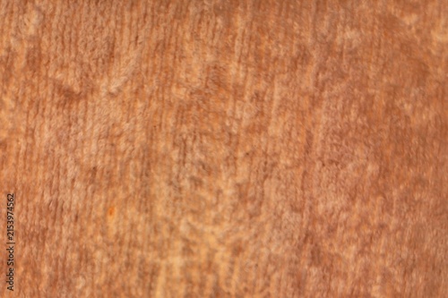 Close-up texture of soft brown fluffy fleece fabric background