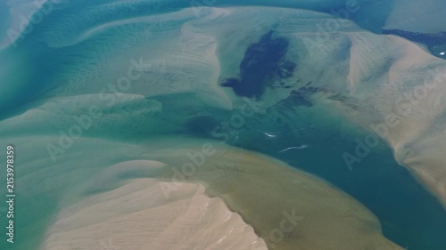 Currents from the North Atlantic Ocean continuously shape the sand banks and beaches of Cape Cod, Massachusetts. The entire peninsula is in constant movement due to its geologic makeup of mostly sand.
