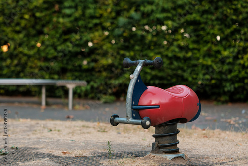 Photography Empty spring rider in a quiet park playground