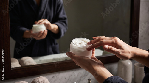 Close-up of hands wrapping a medical bandage around a wrist, representing first aid treatment, injury care and medical emergency response. Perfect for business and lifestyle stock photography.