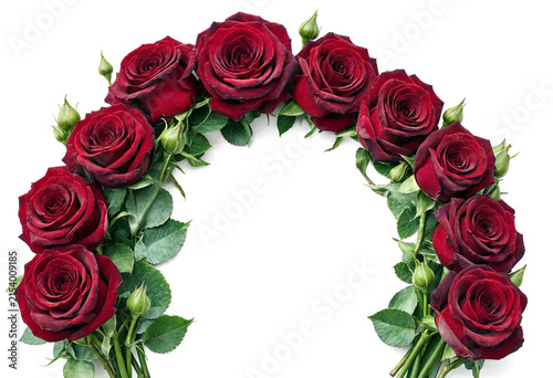 Beautiful arrangement of deep red roses forming a perfect arch shape with green leaves