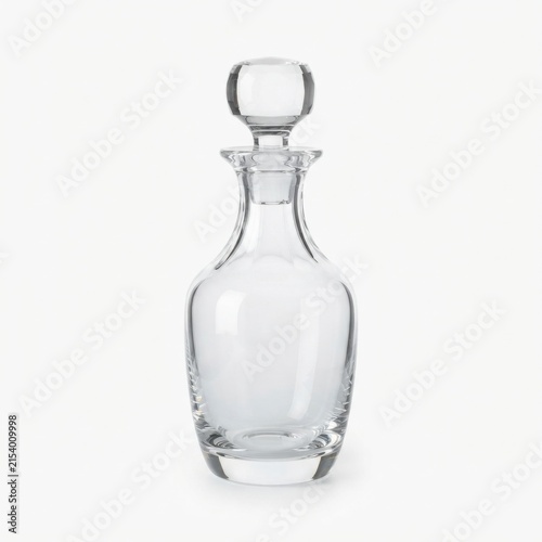 Clear glass decanter with stopper on white background