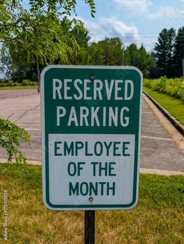 Reserved parking employee of the month sign