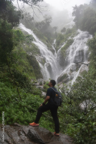 Hiker asian happy feeling freedom good and strong weight victorious facing on the natural mountain. Travel Concept