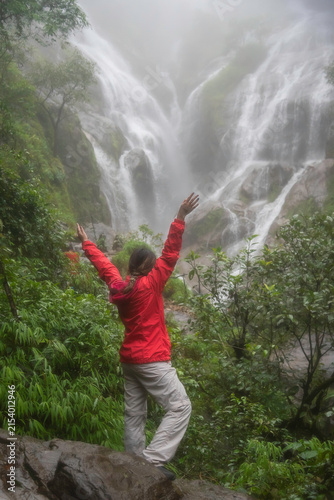 Hiker asian happy feeling freedom good and strong weight victorious facing on the natural mountain. Travel Concept