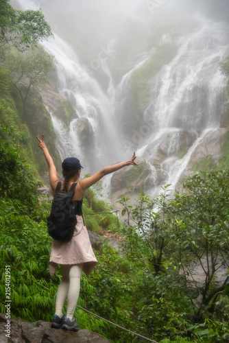 Hiker asian happy feeling freedom good and strong weight victorious facing on the natural mountain. Travel Concept