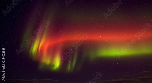 Northern Lights Aurora with Red and Green Glowing in Starry Sky