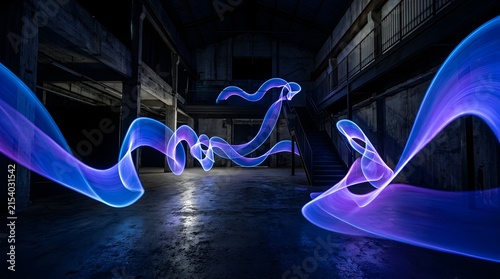Long exposure light painting trails in a dark abandoned industrial