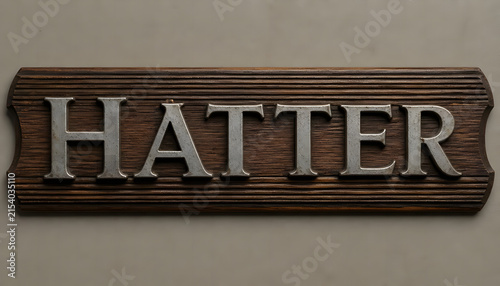 Vintage Metal Hatter Sign on Dark Wood Panel